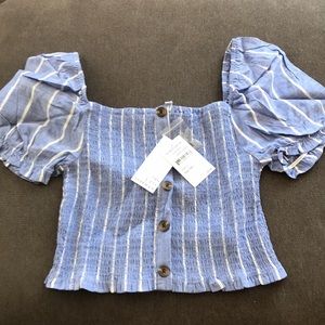 Off the shoulder cropped blouse.